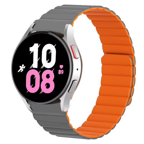 Magnetic Silicone Strap, grey/orange, on a watch, 3/4 front view